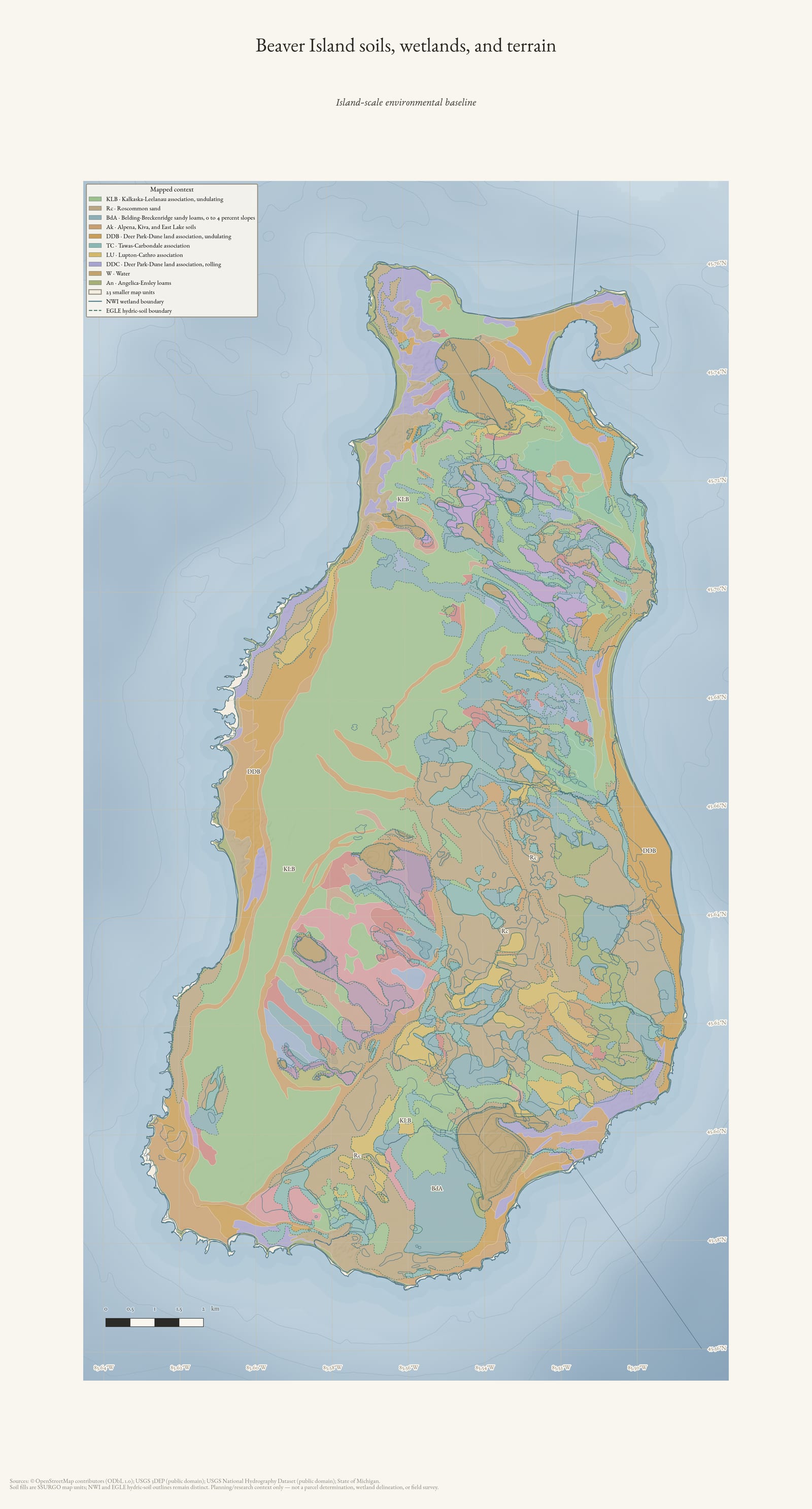 Environmental atlas map of Beaver Island showing soil map units, wetland and hydric-soil outlines, hydrography, and shaded terrain.