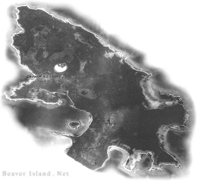 Annotated aerial photograph of a wooded landmass with irregular shorelines, coves, and inland ponds.