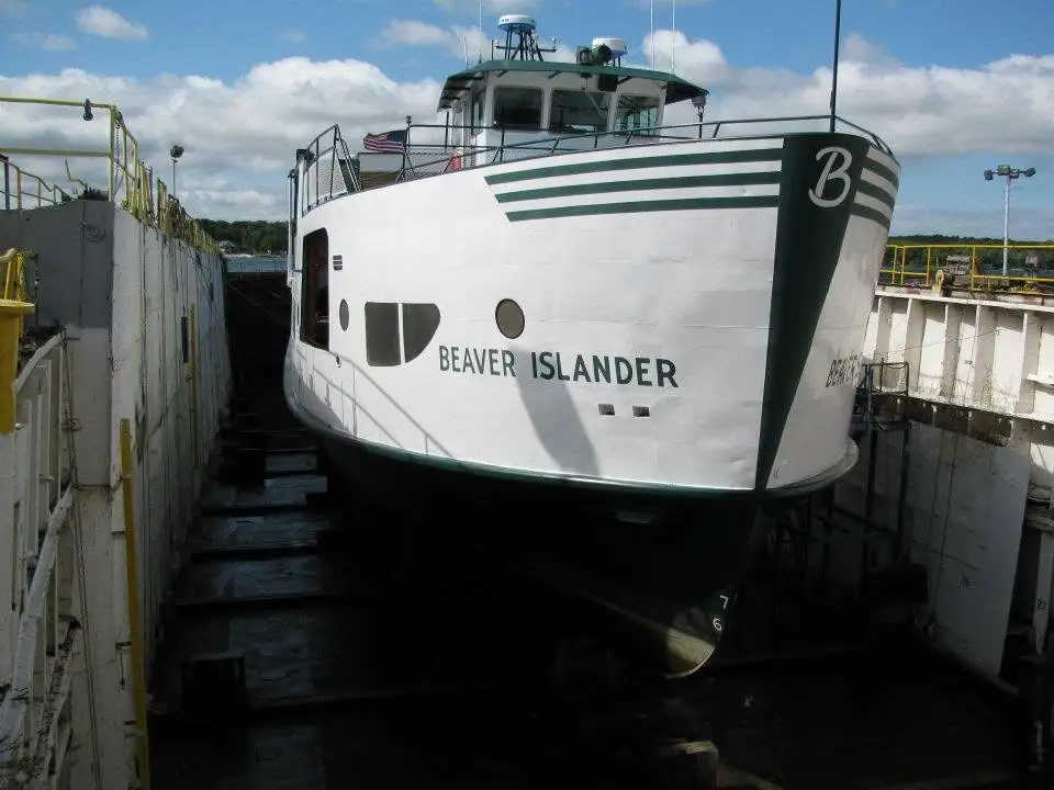 White ferry named BEAVER ISLANDER resting in a dry dock.