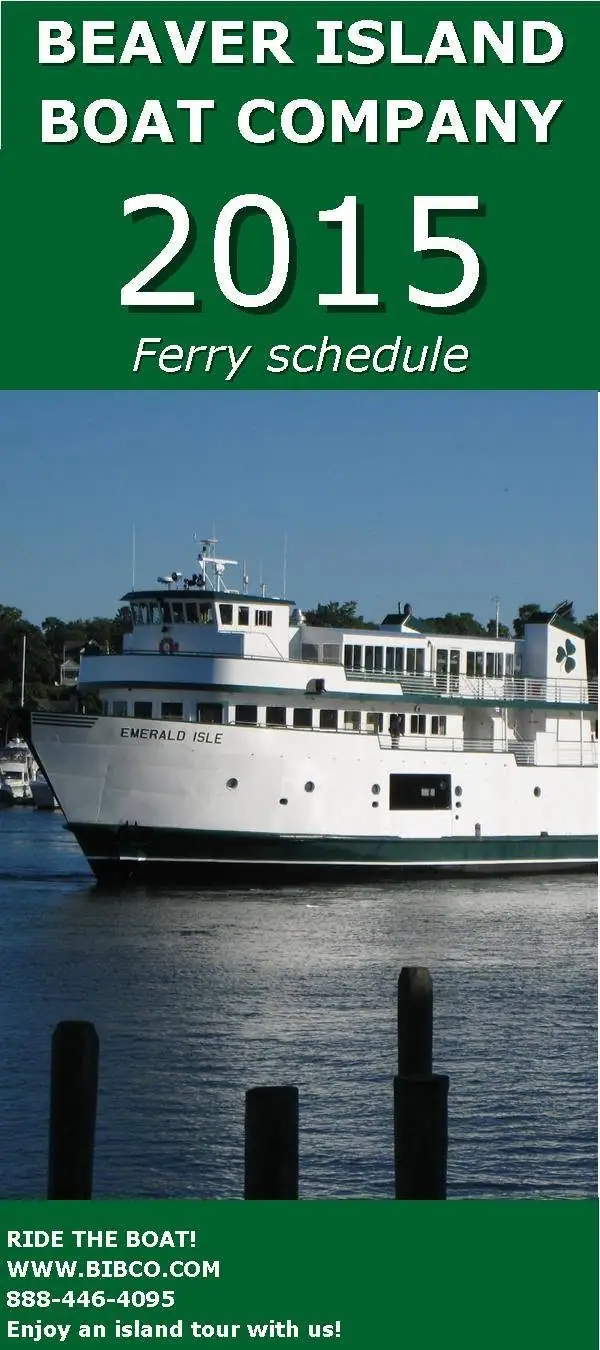 A ferry schedule poster shows a white passenger ferry on the water behind dark dock posts.
