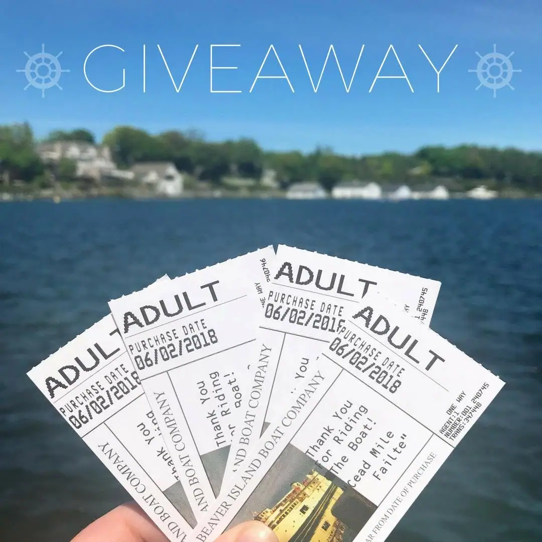 A hand holds several passenger tickets over blue water, with a giveaway graphic and blurred shoreline behind them.