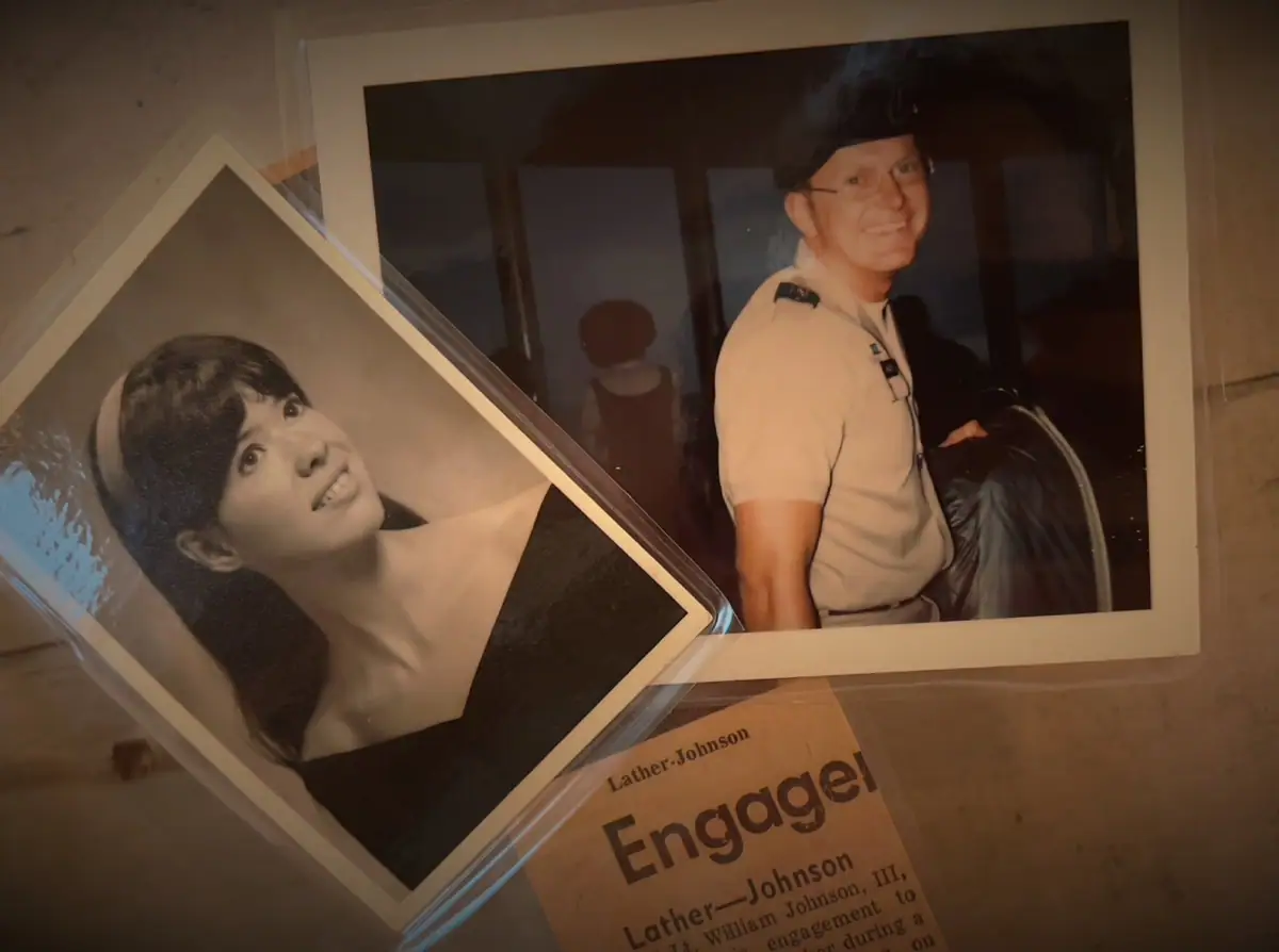 A display panel shows two portraits and printed text about an engagement.