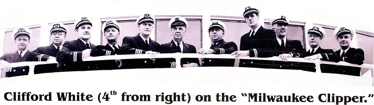 Black-and-white photograph of ten uniformed men standing behind a shipboard railing, with a bold caption below.
