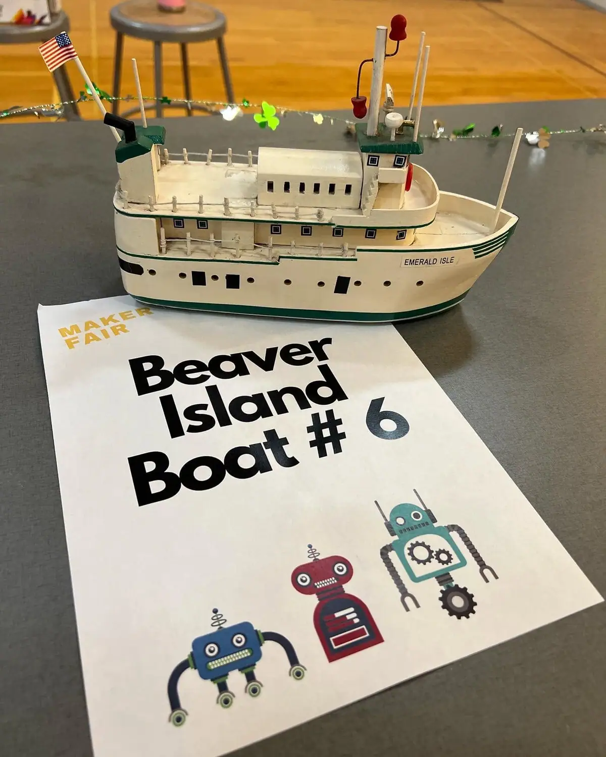 Handcrafted ferry model displayed above a sheet labeled “Beaver Island Boat #6.”
