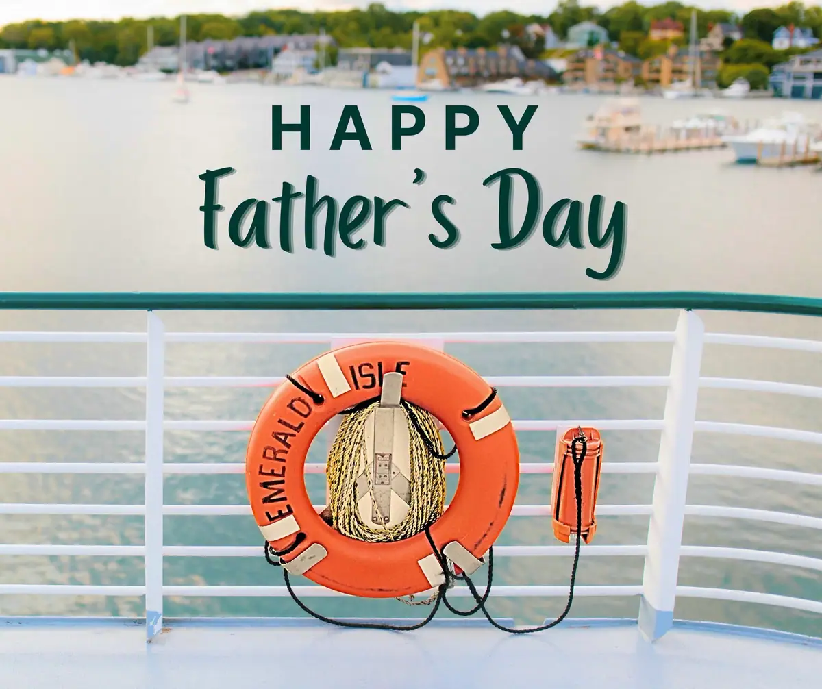 A life ring and whistle hang on a ship railing above a harbor, beneath a Father's Day greeting.