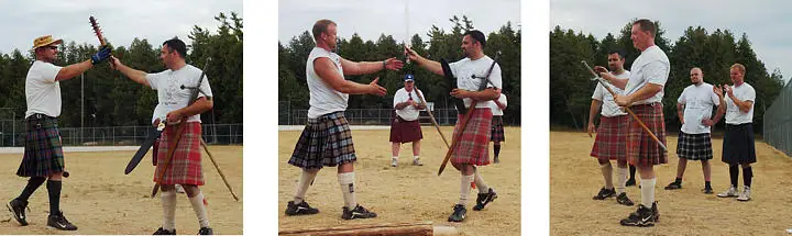 Men in kilts handle long implements on a sandy field.