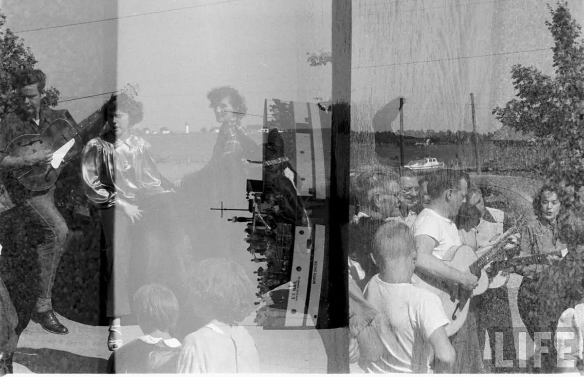 A black-and-white collage shows musicians performing, children watching, and the word “LIFE” at lower right.