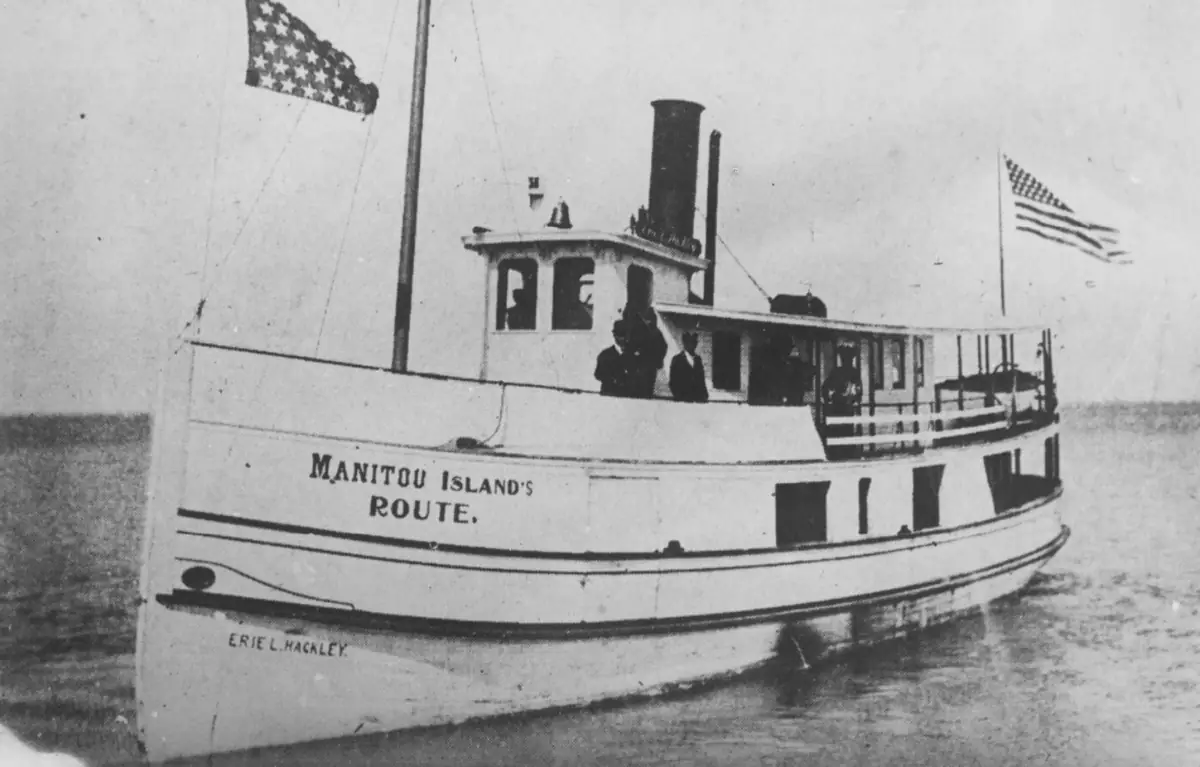 The steamer Erie L. Hackley, bow-on, flying the U.S. flag, her hull lettered